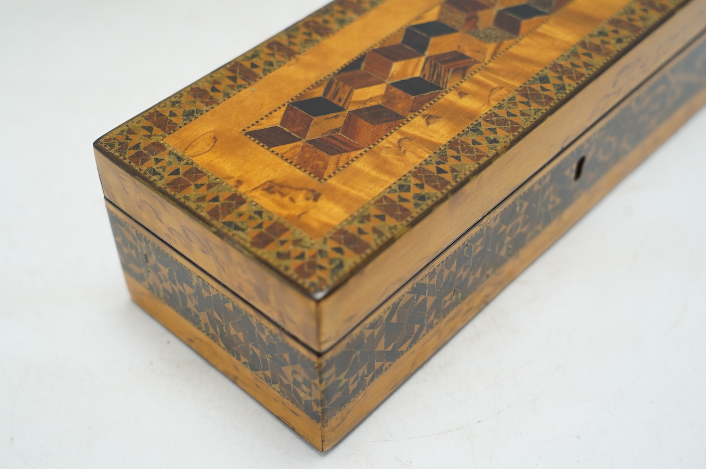 Two Tunbridgeware bird's eye maple half square mosaic glove boxes, c.1825-40, one with key, 24cm. Condition - fair to good